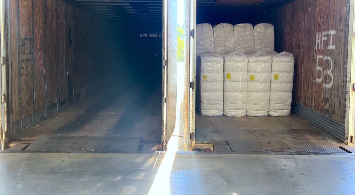 Cotton bales stacked inside a truck
