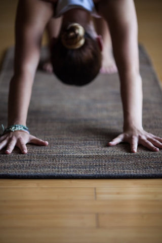 Front view of hands in a downdog yoga position.