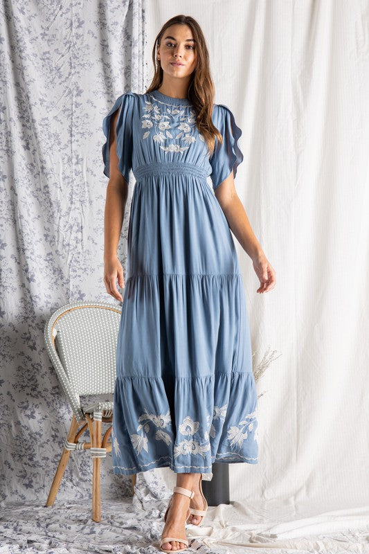 full length view of Women's embroidered maxi dress.