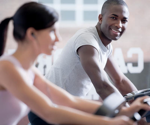 a couple in the gym smiling