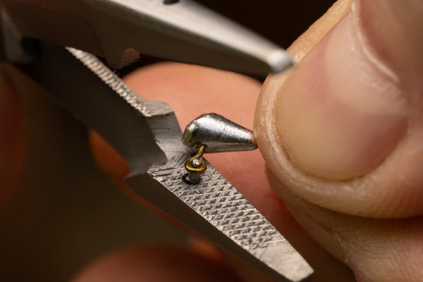 Cleaning the eyelet of a hook using mitten scissors