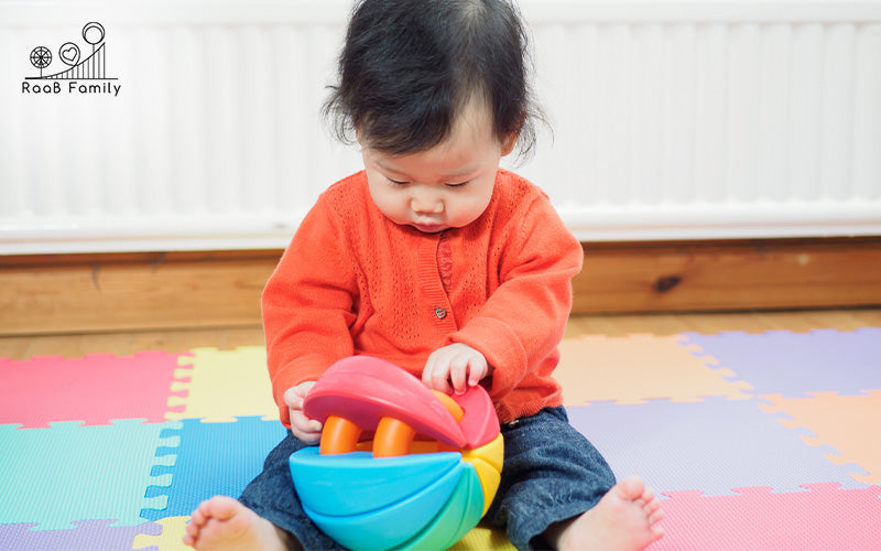 Image of a child playing in the play mat