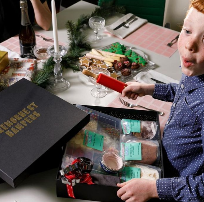 Kids Baking Hampers from Cremorne Street Hampers. Little boy with delighted smile with his baking kit.