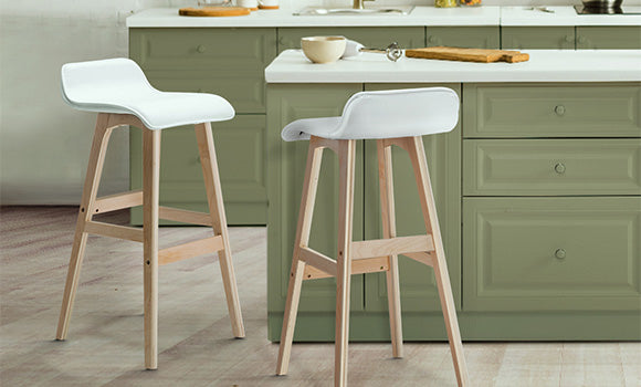 Artiss Silva wooden bar stools in white add an elegant feel to an olive green kitchen.