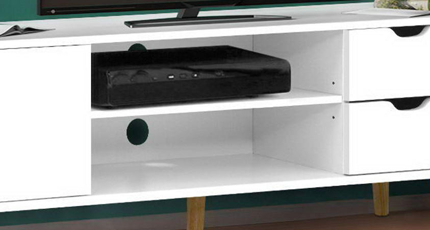 A close up of the Artiss Larin entertainment unit. The centre of the unit is holding a DVD player. The base of a plasma TV and two open magazines are just visible on the top of the unit, and the cable management hole is visible.