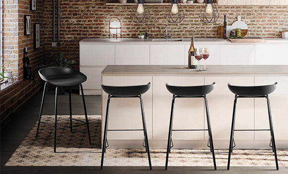 A farmhouse-style kitchen interior featuring our stunning Artiss Fhelip black metal bar stools with an elegant seat design.
