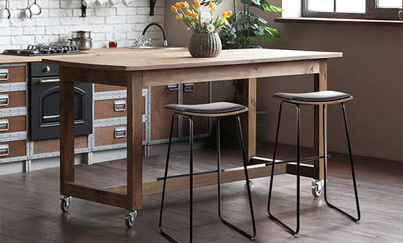Featuring a minimalist design with a sturdy frame and deluxe PU leather padded seat, Artiss Porter saddle-style bar stools make a solid impression in a rustic industrial kitchen. 