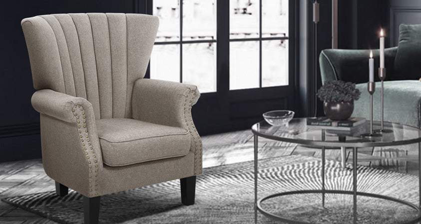 Introducing neutral hues in this dramatic, bold room, our Artiss Andrew wingback armchair in beige brightens this dark room and creates a sense of balance. 