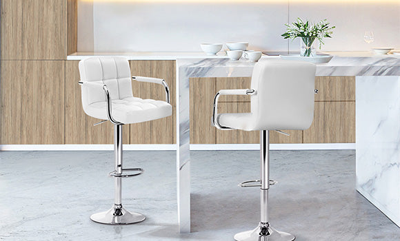 Artiss Noa white swivel bar stools featuring leather upholstery and plush checkered seat are a perfect match in a white marble kitchen. 