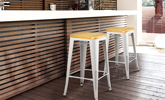Artiss Tolix replica Xavier bar stools in white combining a sturdy metal structure with a stylish bamboo seat creating an Instagrammable ambience in an indoor/outdoor modern kitchen.