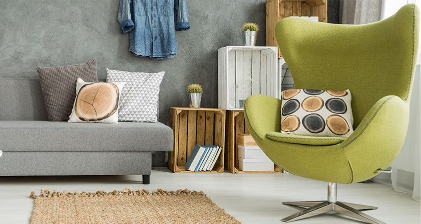 This cosy and comfy egg-shaped armchair in the olive green shade is like a breath of fresh air in this all-grey room. 