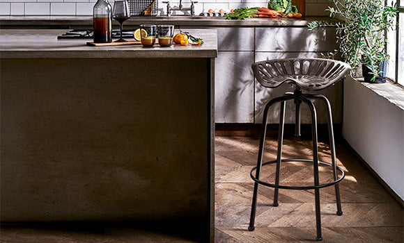 An Artiss Owen bar stool with a funky metal design and convenient footrest perfectly complements this classic-style kitchen. 