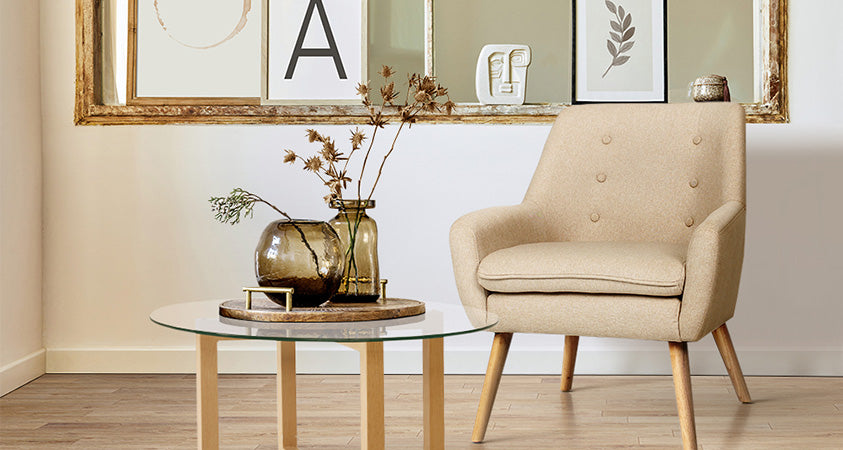 The Artiss Anne armchair in gorgeous beige, styled alongside a glass-top side table, is a good choice for this lighter-coloured room. 