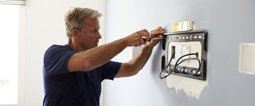 A professional will help you install a wall bracket safely, including electrical components.