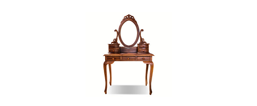 A vintage solid wood vanity with a dark wood finish and ornately carved frame. Perfect for a glamorous provincial look.