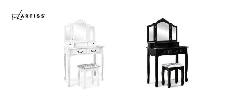 The Artiss Marie dressing table and stool set in black and white. Features four drawers with retro style handles, a three panel mirror and an embroidered cushion.
