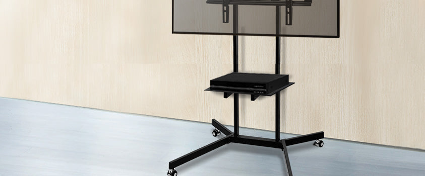An Artiss portable TV mount and stand. The stand has one small shelf and four caster wheels for ease of movement.