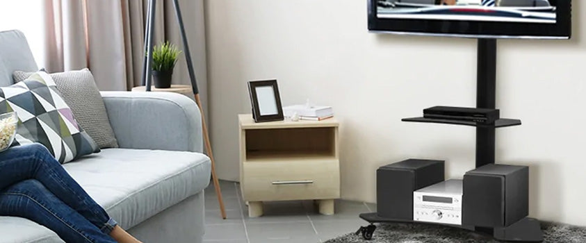 An Artiss TV floor stand with two black tempered glass shelves, holding an entertainment system. Perfect for small lounges.
