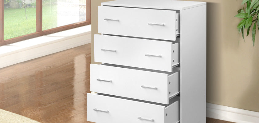 An Artiss simple 4-drawer white chest of drawers, set in a light living room. The drawers are each pulled out slightly.