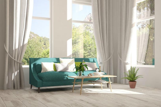 living room sun shine in bright through curtained windows on a sofa