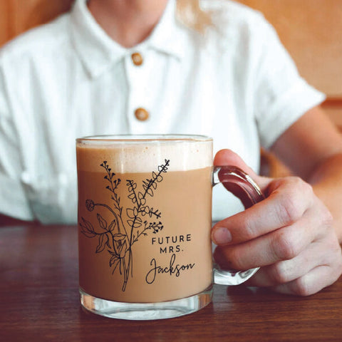 bride to be holding a bridal shower gift mug