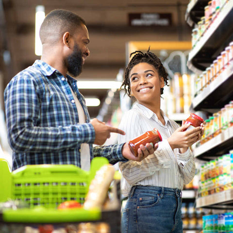 couple at store shopping for date night items