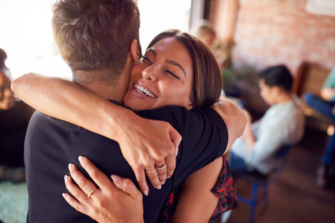 couple hugging at a restaurant