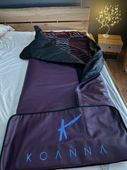 Koanna infrared sauna blanket in bed