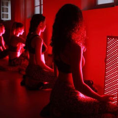 Women meditating with Red Light Therapy