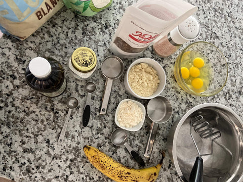 Photo of ingredients and tools on a kitchen countertop to make gluten free grain free no sugar added waffles