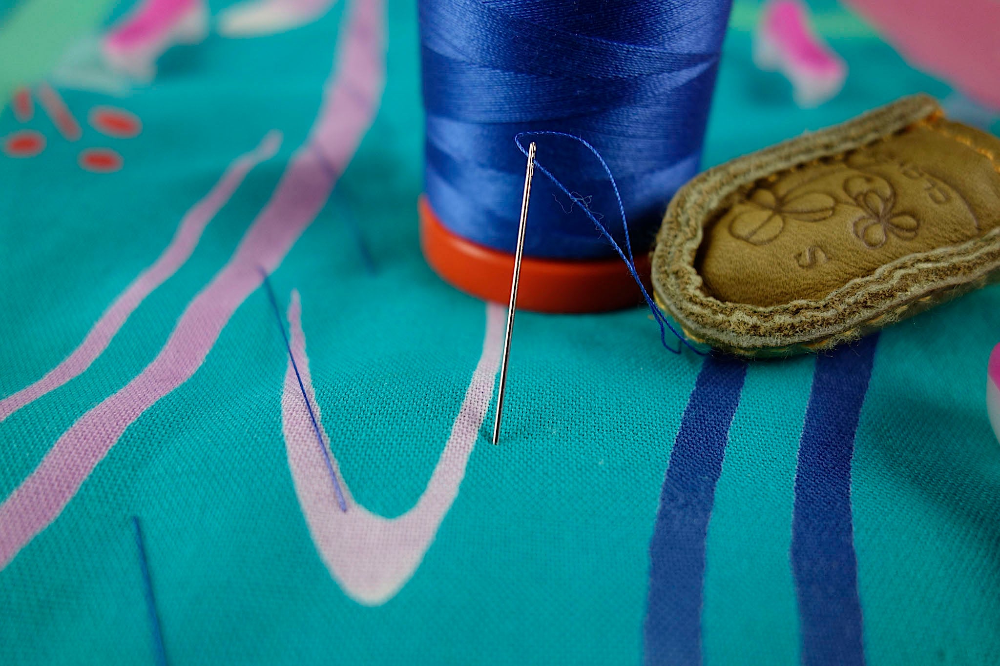 Tailor basting the quilt sandwich together