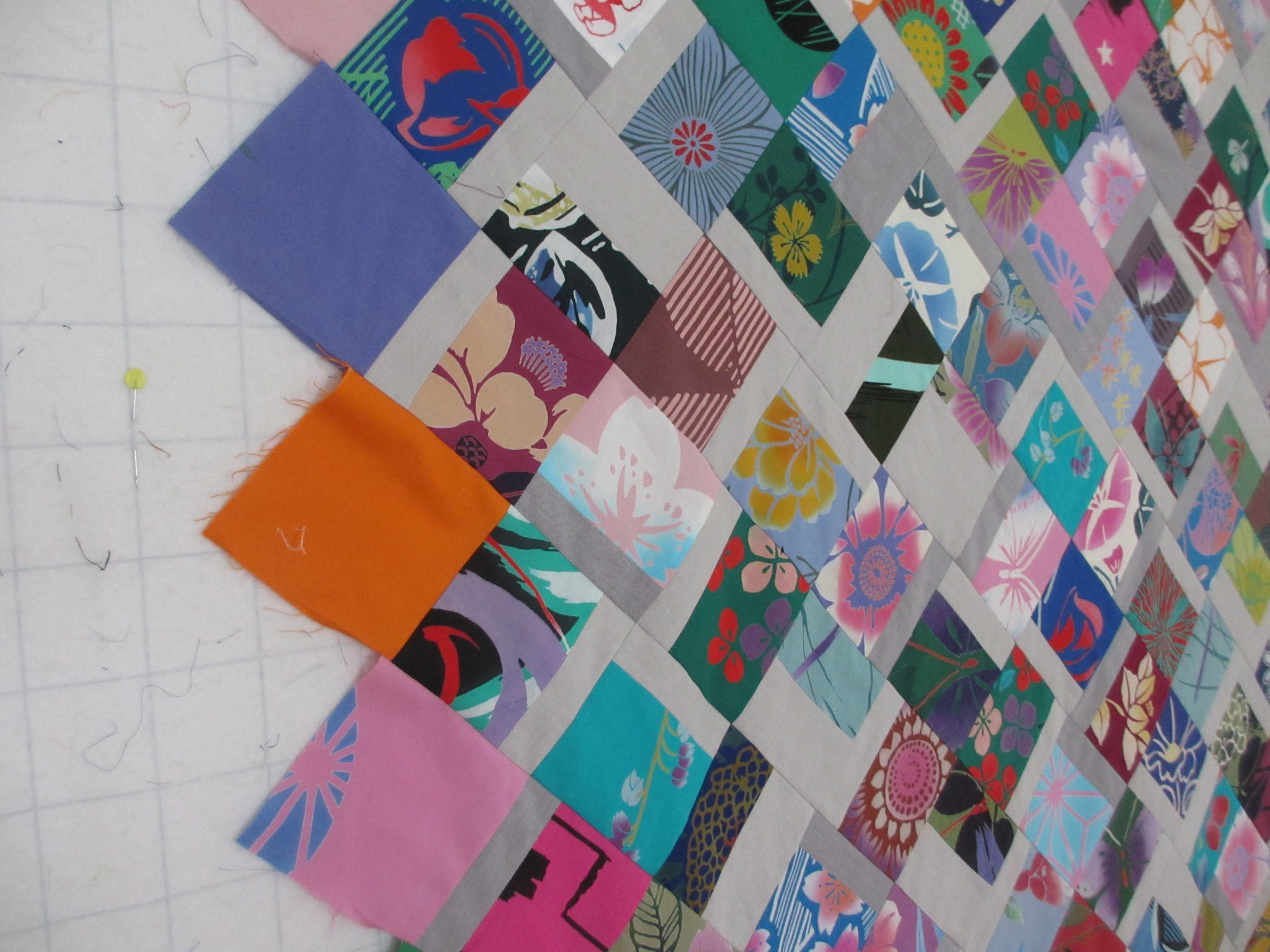 Scrappy Hatchi Quilt, in progress, by Patricia Belyea