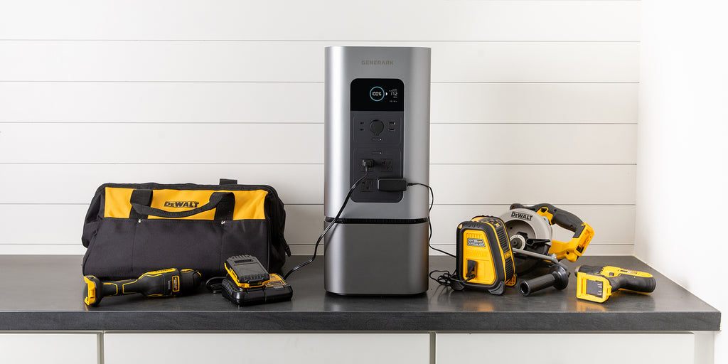 The HomePower 2 is on a counter with power tools plugged into it.