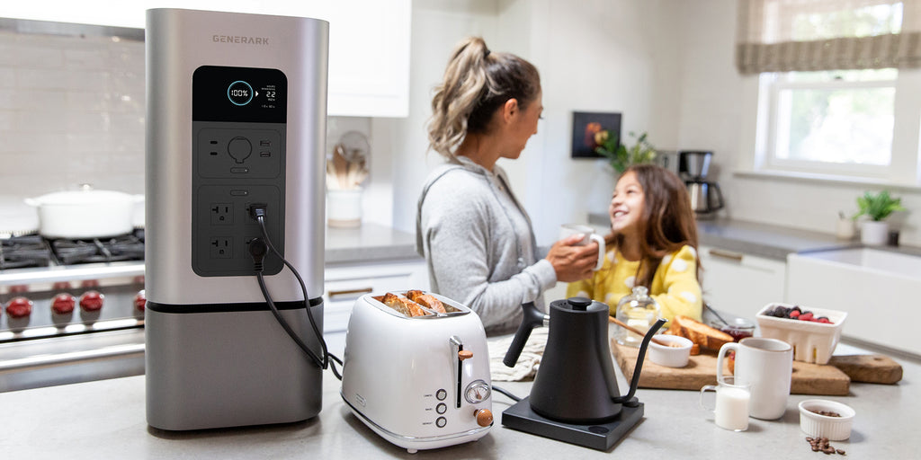 A woman and child use kitchen appliances powered by the HomePower 2.