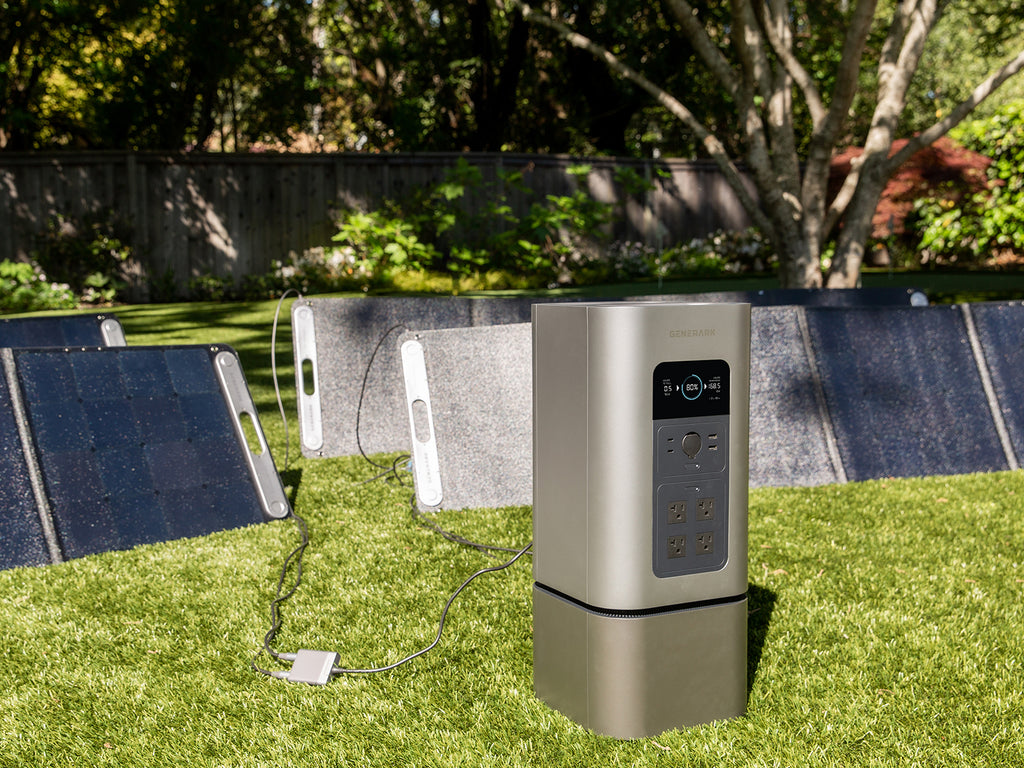 The HomePower 2 charged in a backyard from the SolarPower 2 solar panels.