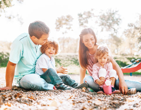 Family Playing in Sandbox at the Park