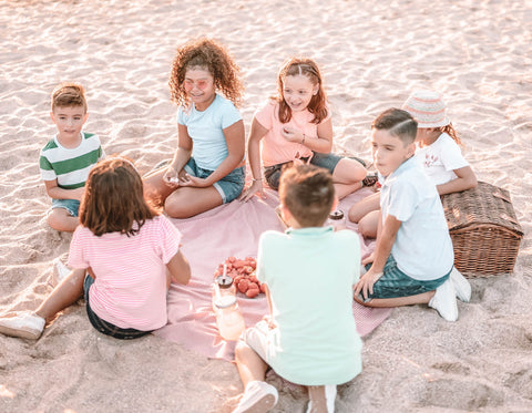 Group of Kids Having A Picnic on the Beach