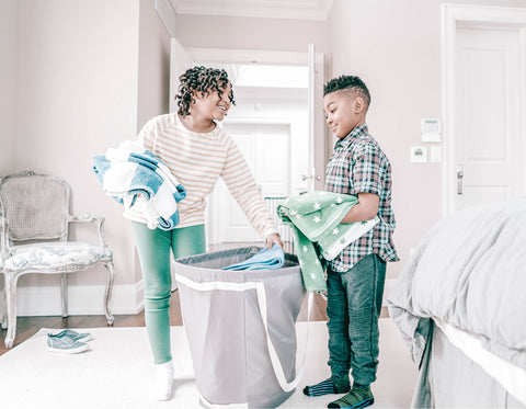 Kids putting away laundry