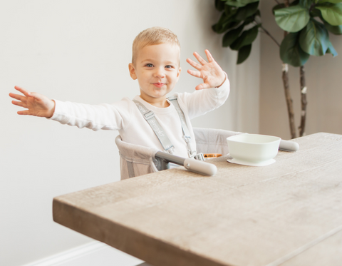 Little Boy in Easy Diner at Table Eating Breakfast