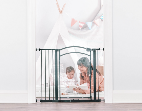 Mom and Daughter Reading a Book Behind In Sight Safety Gate