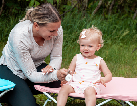 Mom and Daughter Roasting Marshmallows on My Cot Pal