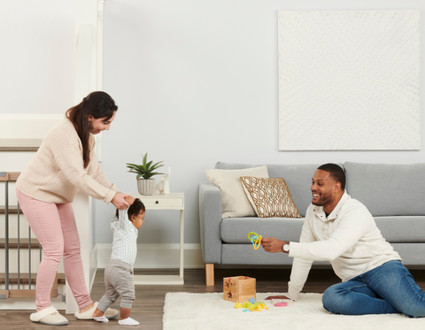 Family Playing in Living Room with Their Toddler