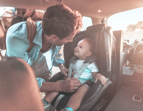 Dad Buckling In Toddler In The Car