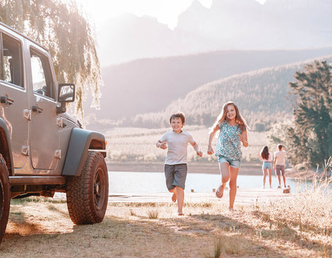 Family Outside of Car By The Lake