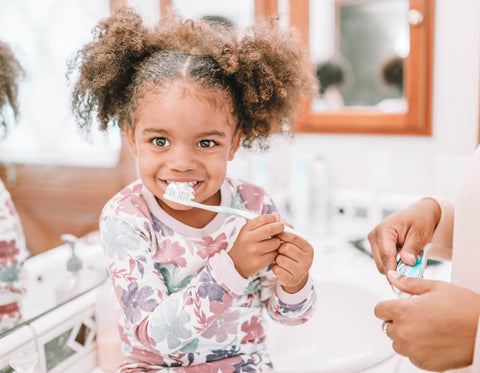 Little Girl Brushing Her Teeth