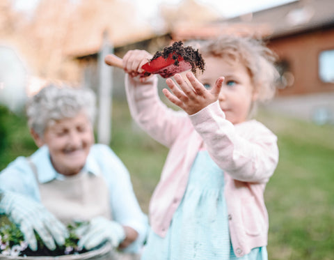 Grandma with Toddler in Garden