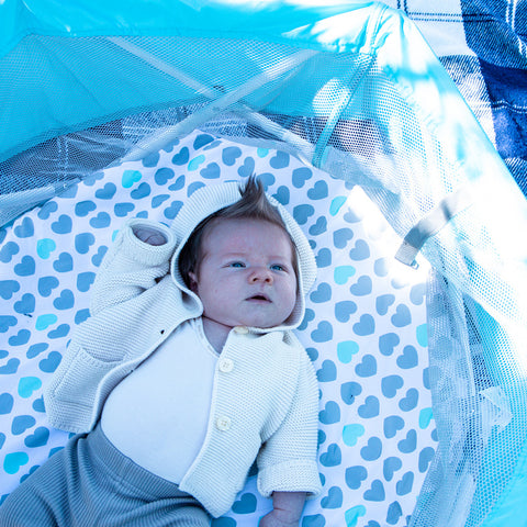 baby on the portable bassinet