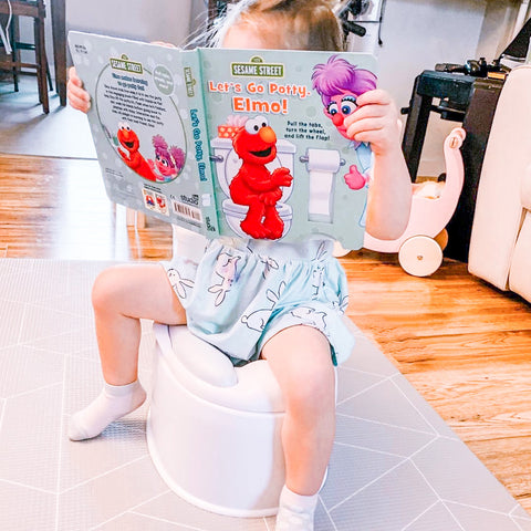 little girl on toddler potty