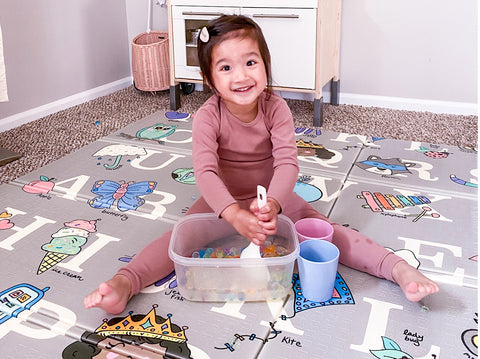 child playing on mat