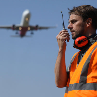 Airport worker giving instructions